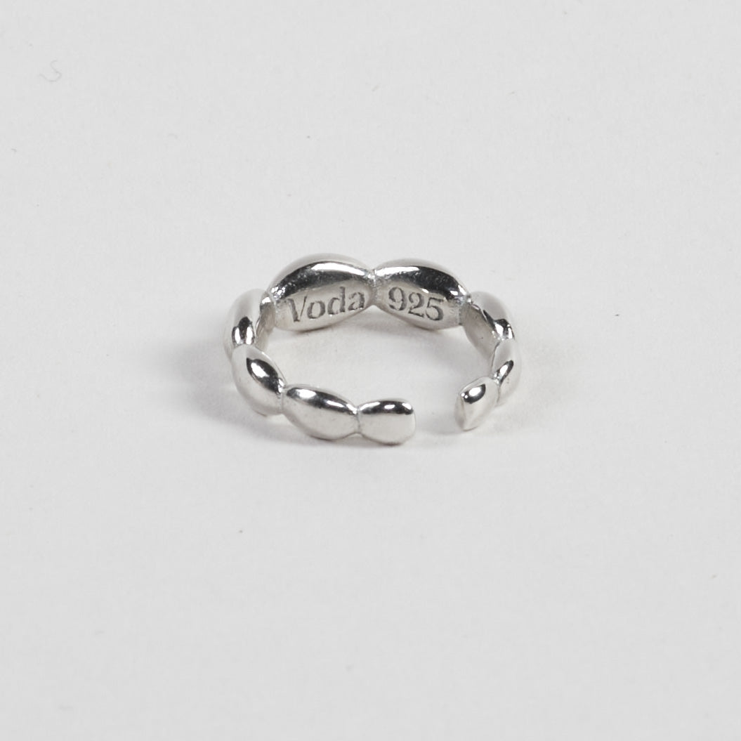 Elegant ear cuff made from 100% recycled 925 sterling silver – featuring seamlessly connected, polished round lenses for a captivating light-reflecting effect. Sits comfortably in the middle of the ear and pairs beautifully with other cuffs for a layered look. Sustainably crafted in Europe, hypoallergenic, with a special alloy to reduce tarnishing.